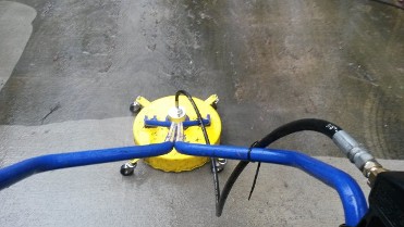 A yellow and blue air pump on the ground